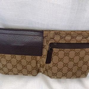 GUCCI double-pocket GG canvas belt bag